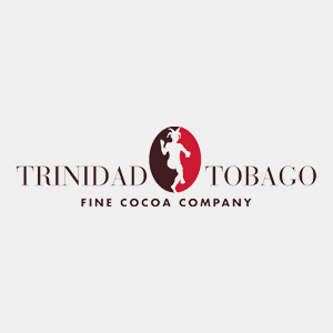 Logo for Trinidad and Tobago Fine Cocoa Company featuring a stylised figure in white within a red oval between the words "Trinidad" and "Tobago" on a light background, celebrating handcrafted chocolate and premium Trinitario chocolate. | Trinitario