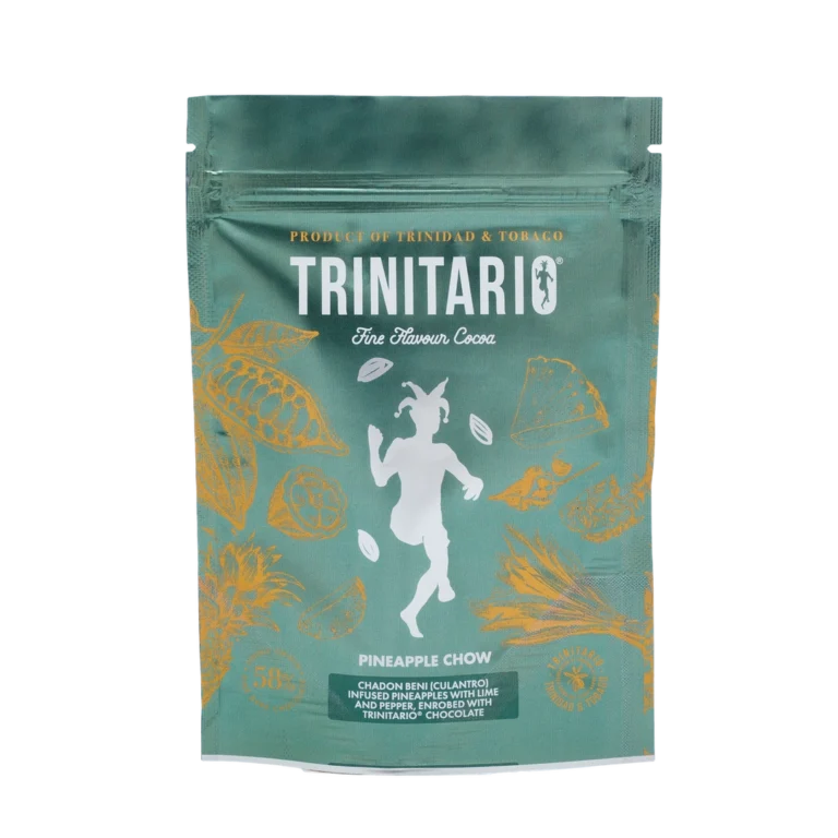 A green Trinitario chocolate pouch labelled "Pineapple Chow" features gold Caribbean cocoa pod illustrations and a central white figure. The text highlights it as a single-origin chocolate product of Trinidad & Tobago. | Trinitario