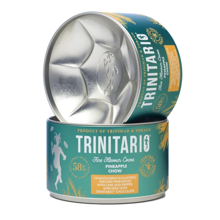 A tin of Trinitario Fine Flavour Cocoa Pineapple Chow with the lid partially open, showcasing its branding and label details. Made with sustainably grown chocolate for a rich and flavourful experience. | Trinitario