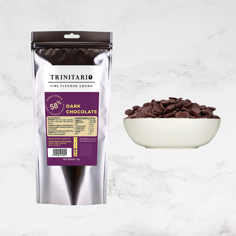 A silver pouch labelled "58% Dark Chocolate Callets, 1kg" made with fine flavour cocoa stands beside a white bowl filled with dark chocolate chips on a light background. | Trinitario