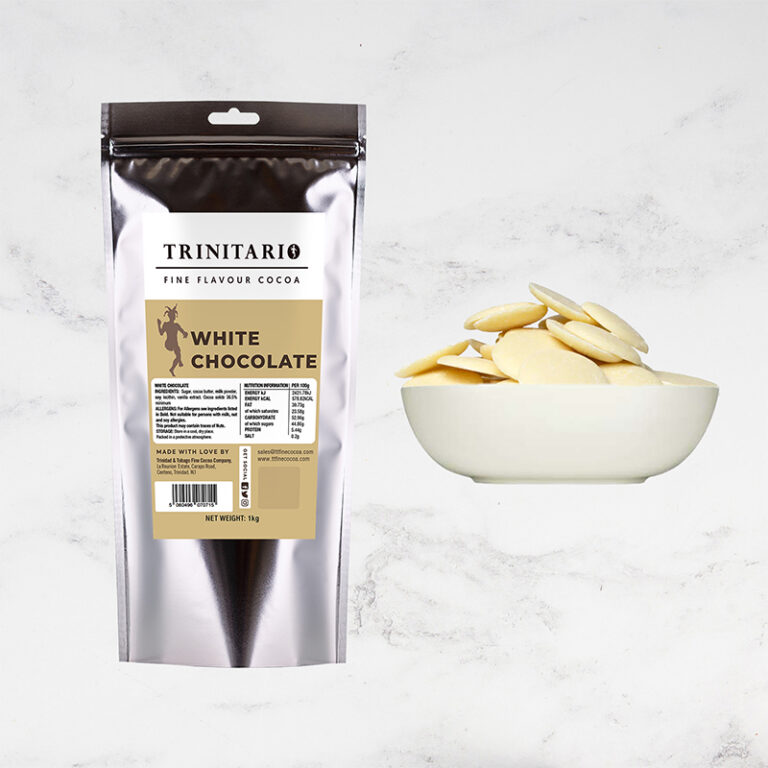 A silver pouch labelled "36.5% White Chocolate Callets, 1kg" stands beside a white bowl filled with single-origin chocolate callets on a light marble surface. | Trinitario